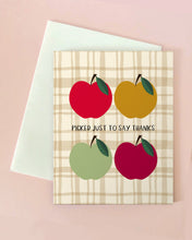 Card with red, yellow, and green apples on a plaid background with text 'Picked just to say thanks'.