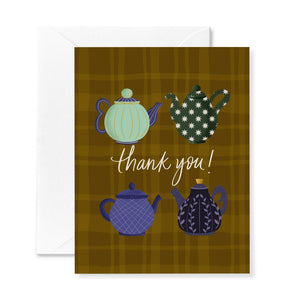 Greeting card with teapot illustrations and 'thank you!' text on a plaid background
