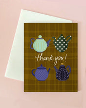 Greeting card with teapot illustrations and 'thank you!' text on a plaid background